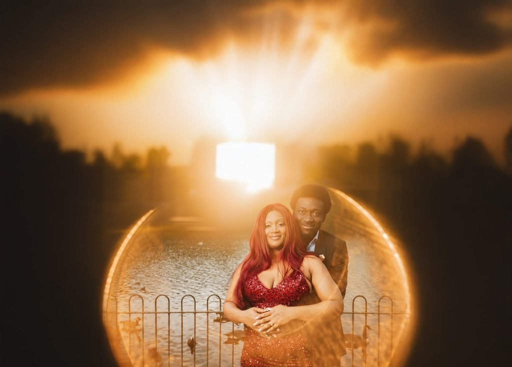 Couple embracing by a shimmering sunset.